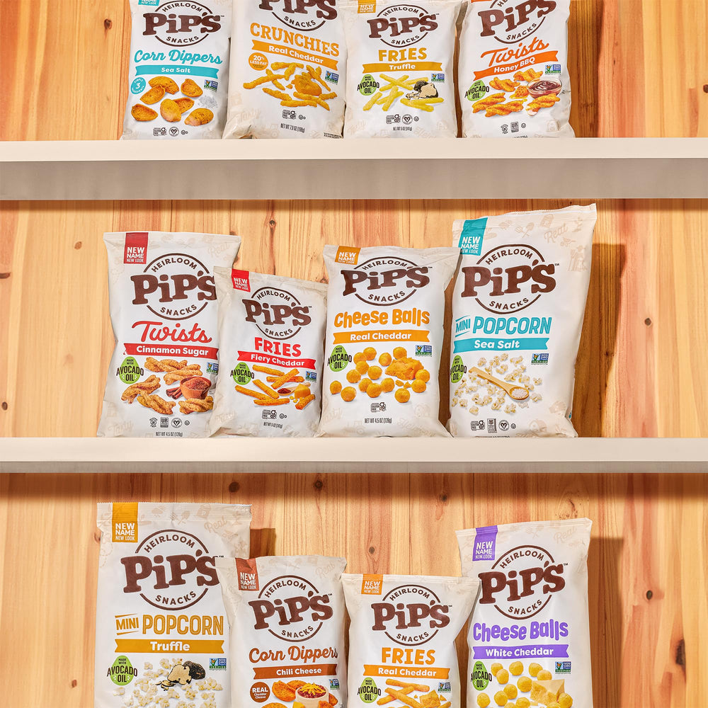 Pipcorn cheddar balls packaging on shelf signals ready-to-eat family snack.