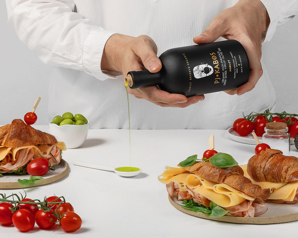 P.J. KABOS olive oil cooking in pan suggests all-purpose heat tolerance and flavor.