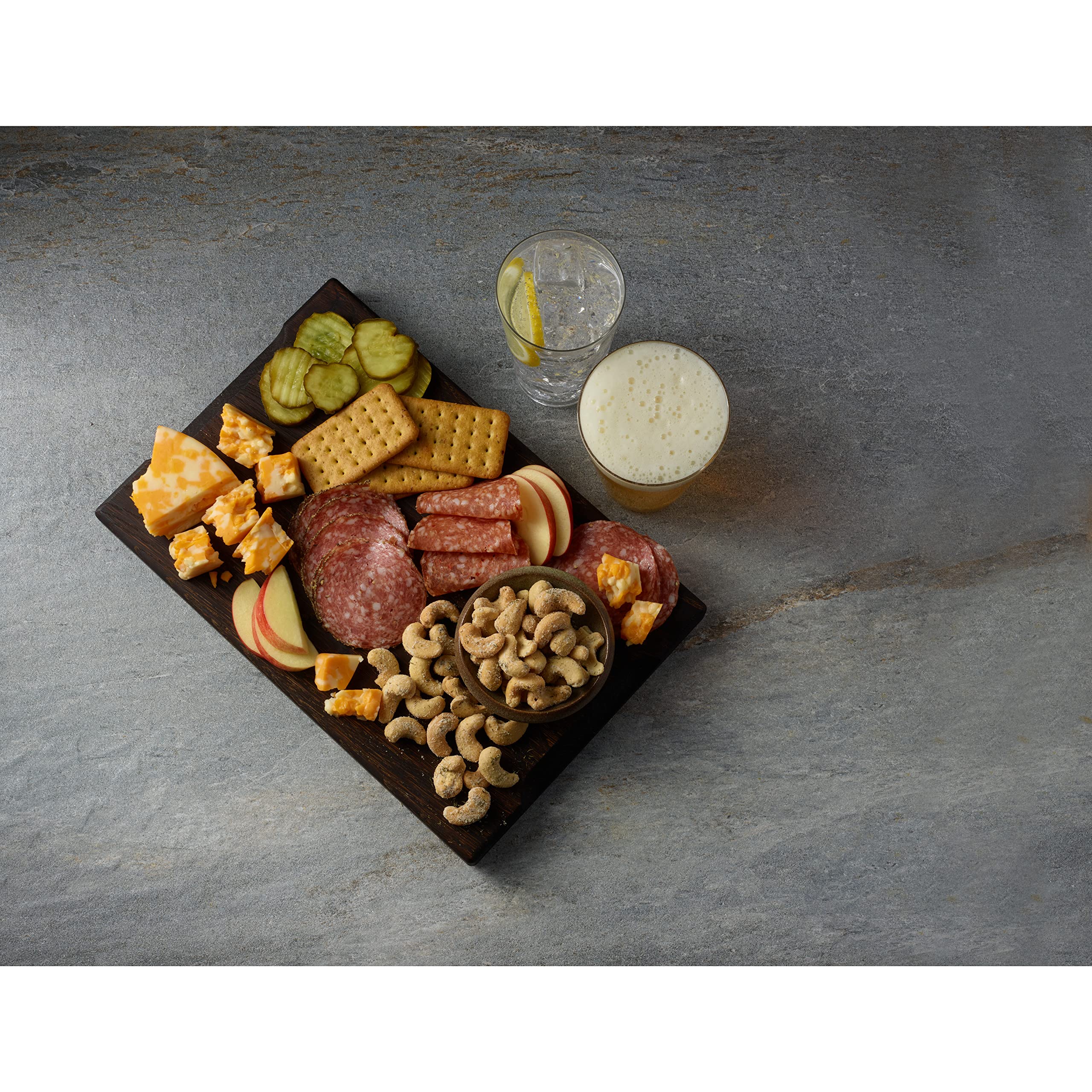 Planters Dill Pickle cashews at a party, savory trail mix option for guests