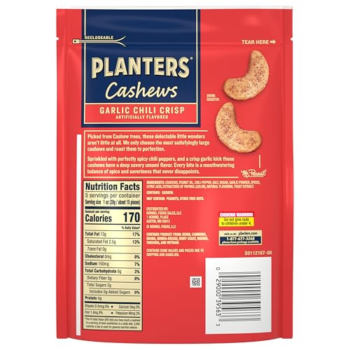 Planters Garlic Chili Crisp Cashews close-up; creamy roasted texture with a spicy kick for snacking.