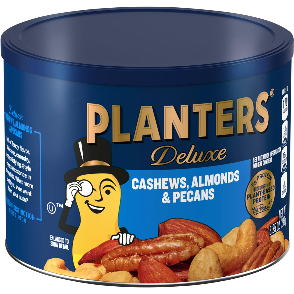 Planters Select Cashews Almonds Pecans on an office desk during a break.