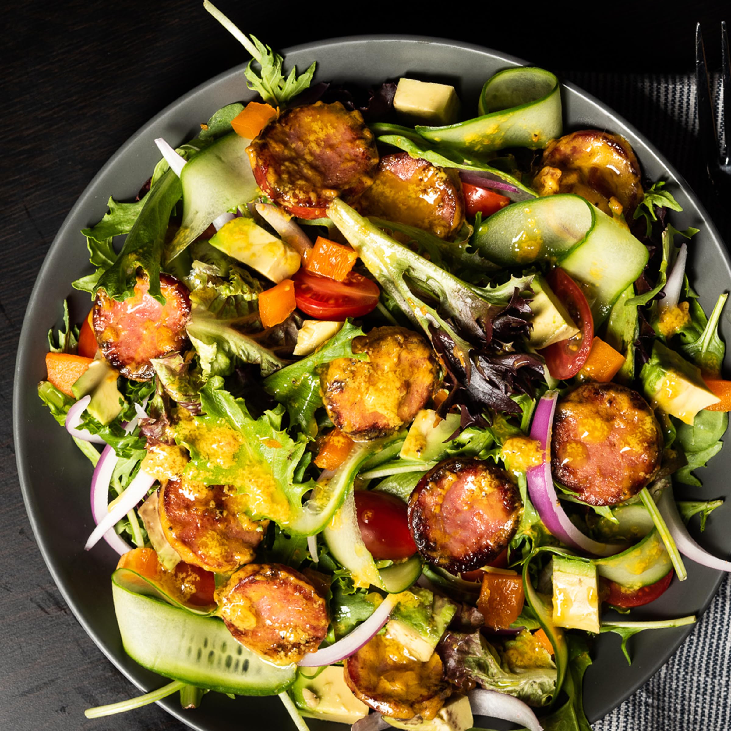 Plochman's The Works Mustard blends into salad dressings for zesty flavor.