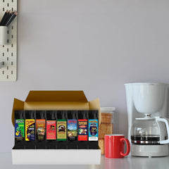 Plum Nellie gift box opened to reveal assorted single-origin coffee grounds.