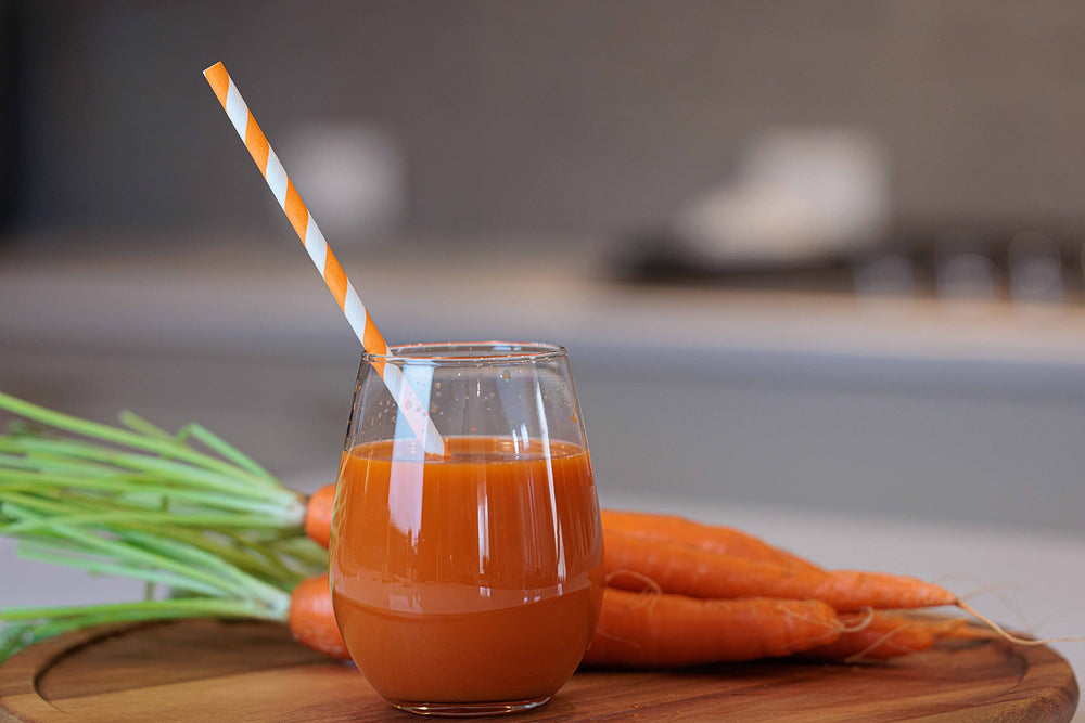 Pomona Organic Carrot Juice served with sparkling water suggests a refreshing mix.