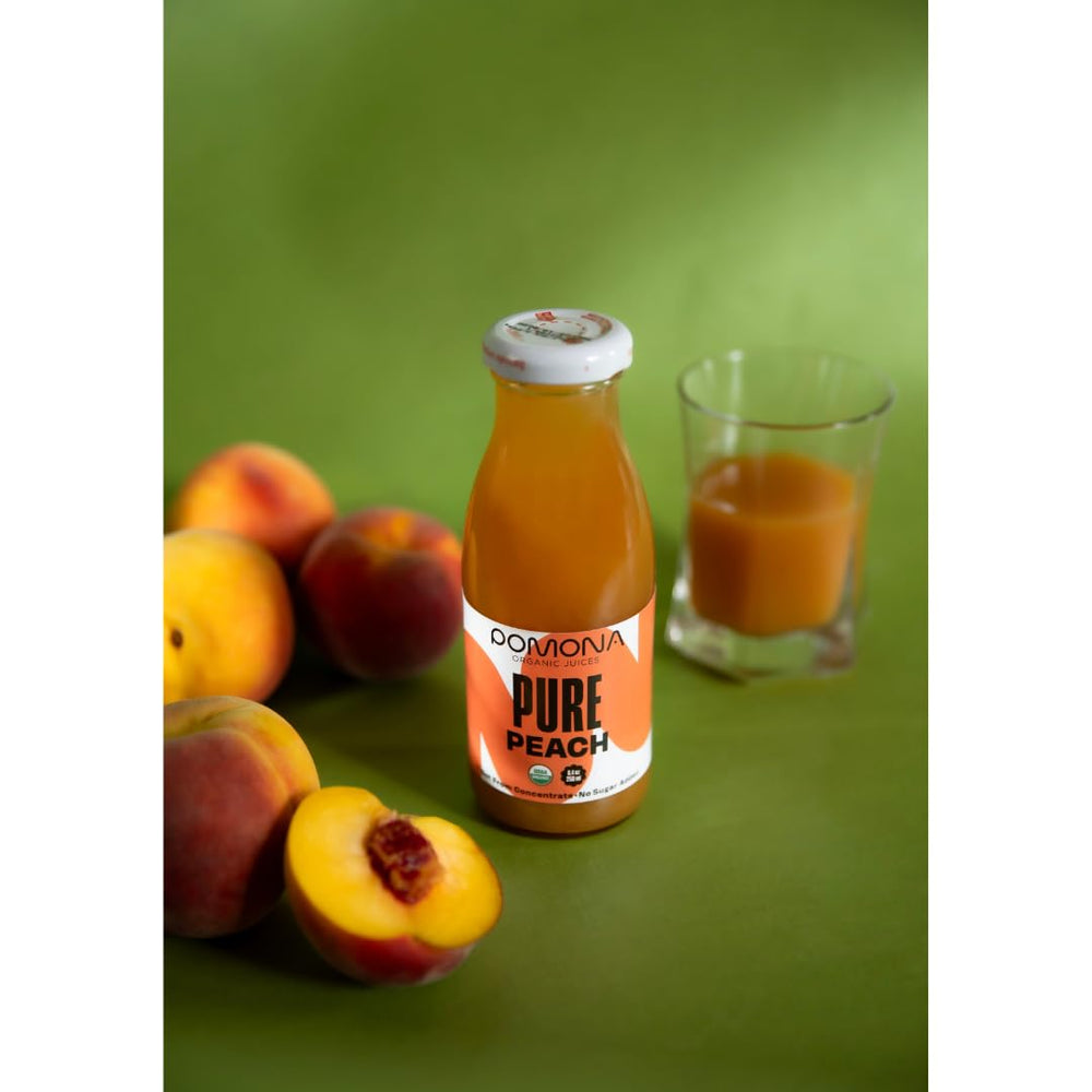 Pomona Organic Peach Juice on a store shelf as premium option