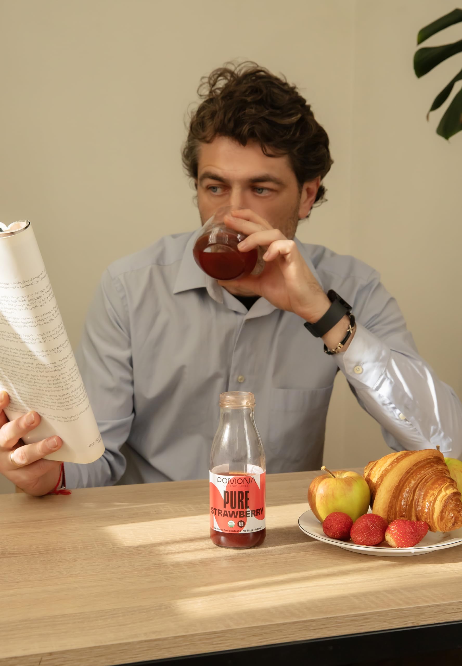 Pomona Organic Strawberry Juice glass bottle on counter; everyday meals and quick drinks