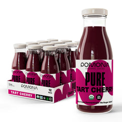 Pomona Organic Tart Cherry Juice bottle on a kitchen counter, pure organic flavor for everyday sipping.