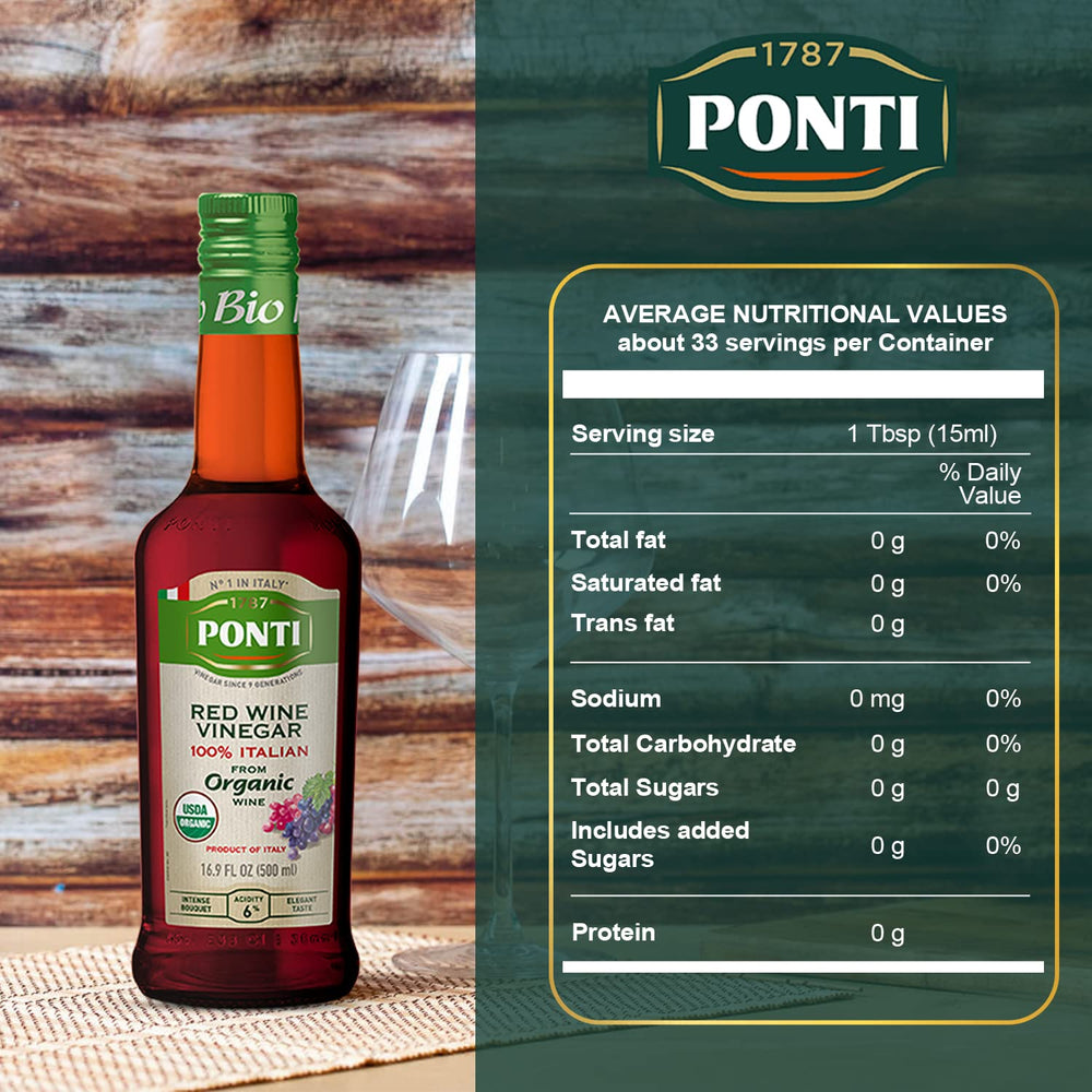 Ponti red wine vinegar being poured onto a fresh salad.