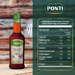 Ponti red wine vinegar being poured onto a fresh salad.
