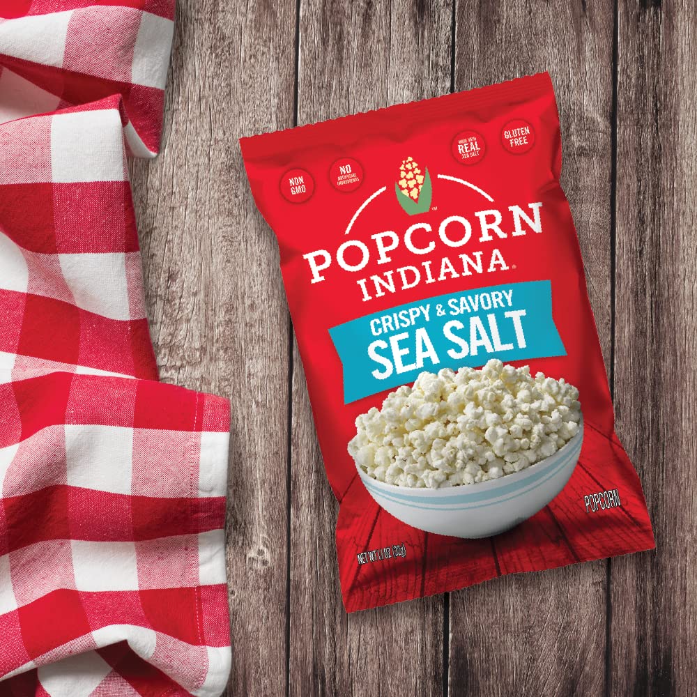 Popcorn Indiana Sea Salt Popcorn close-up highlighting glossy kernels and sea salt flakes.