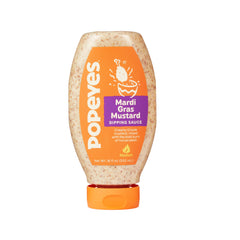 Popeyes Mardi Gras Mustard bottle pouring for bold dipping and flavor.