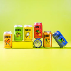 Popwell Cherry Citrus 12-pack cans arranged for gatherings and on-the-go