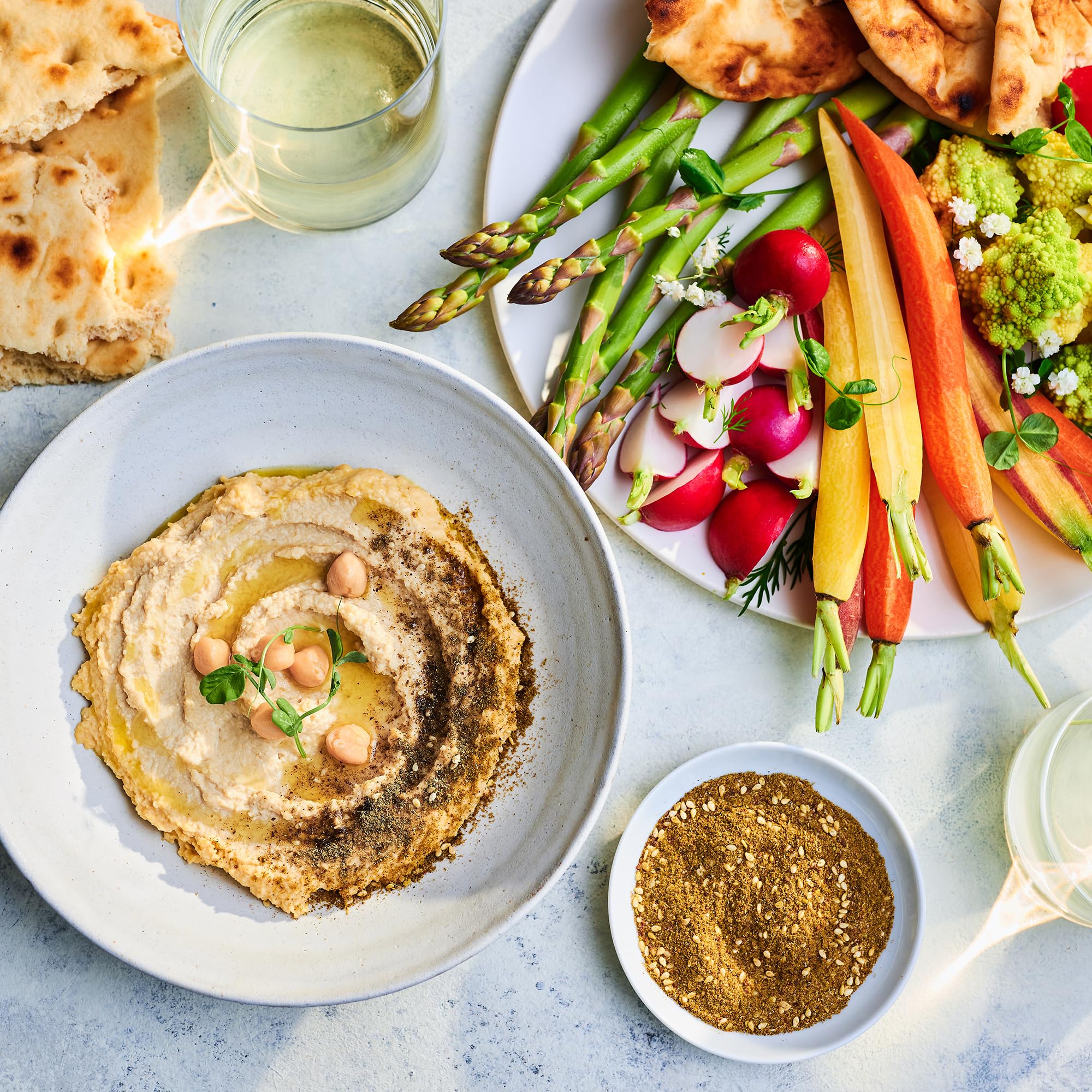 Za’atar spice blend added to a vibrant salad for Middle Eastern flair