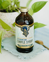 Portland Syrups bottle in a cocktail glass illustrating versatile mixer