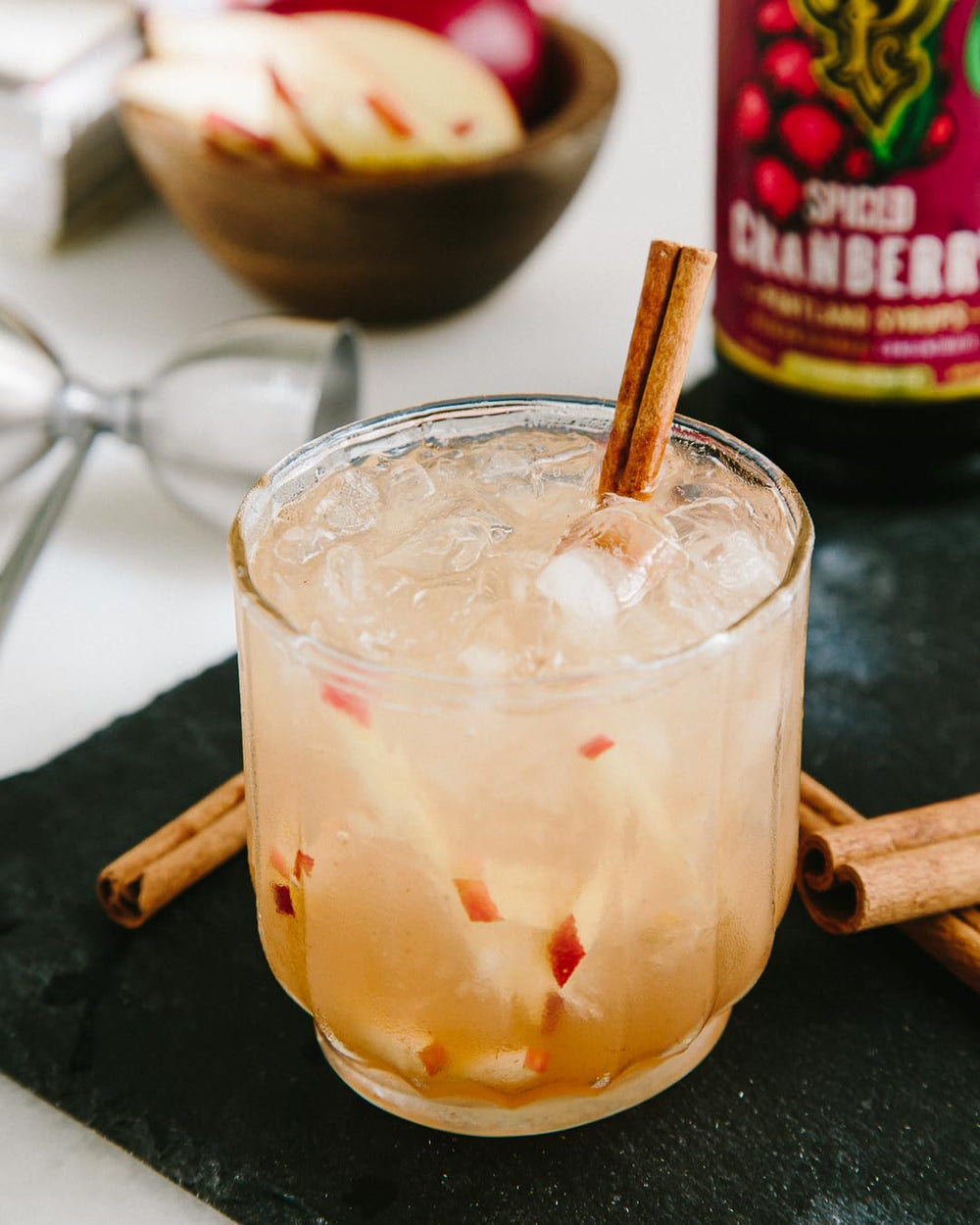 Portland Syrups Spiced Cranberry Syrup on a holiday table for mulled drinks.