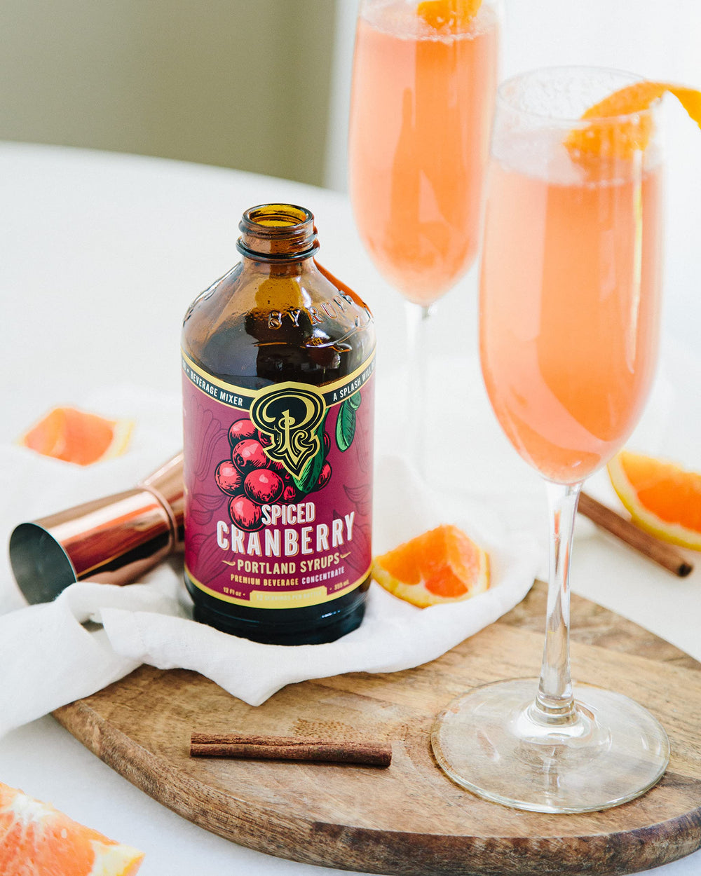Portland Syrups Spiced Cranberry Syrup in a mocktail setting, great for festive non-alcoholic drinks.
