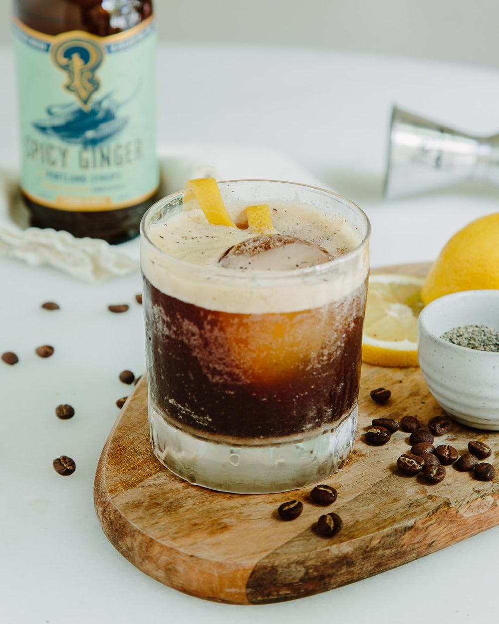 Pouring Portland Syrups Spicy Ginger into a chilled glass.