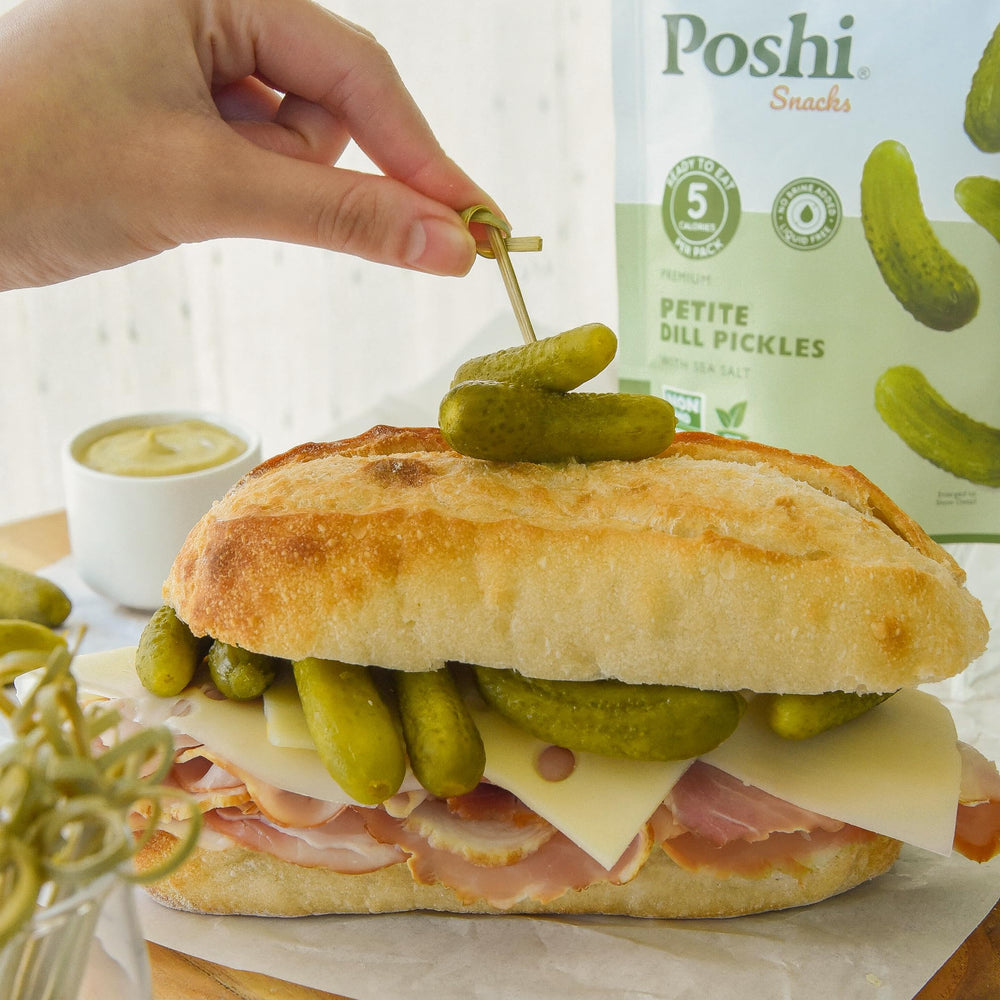 Poshi Petite Dill Pickles on a grocery store shelf