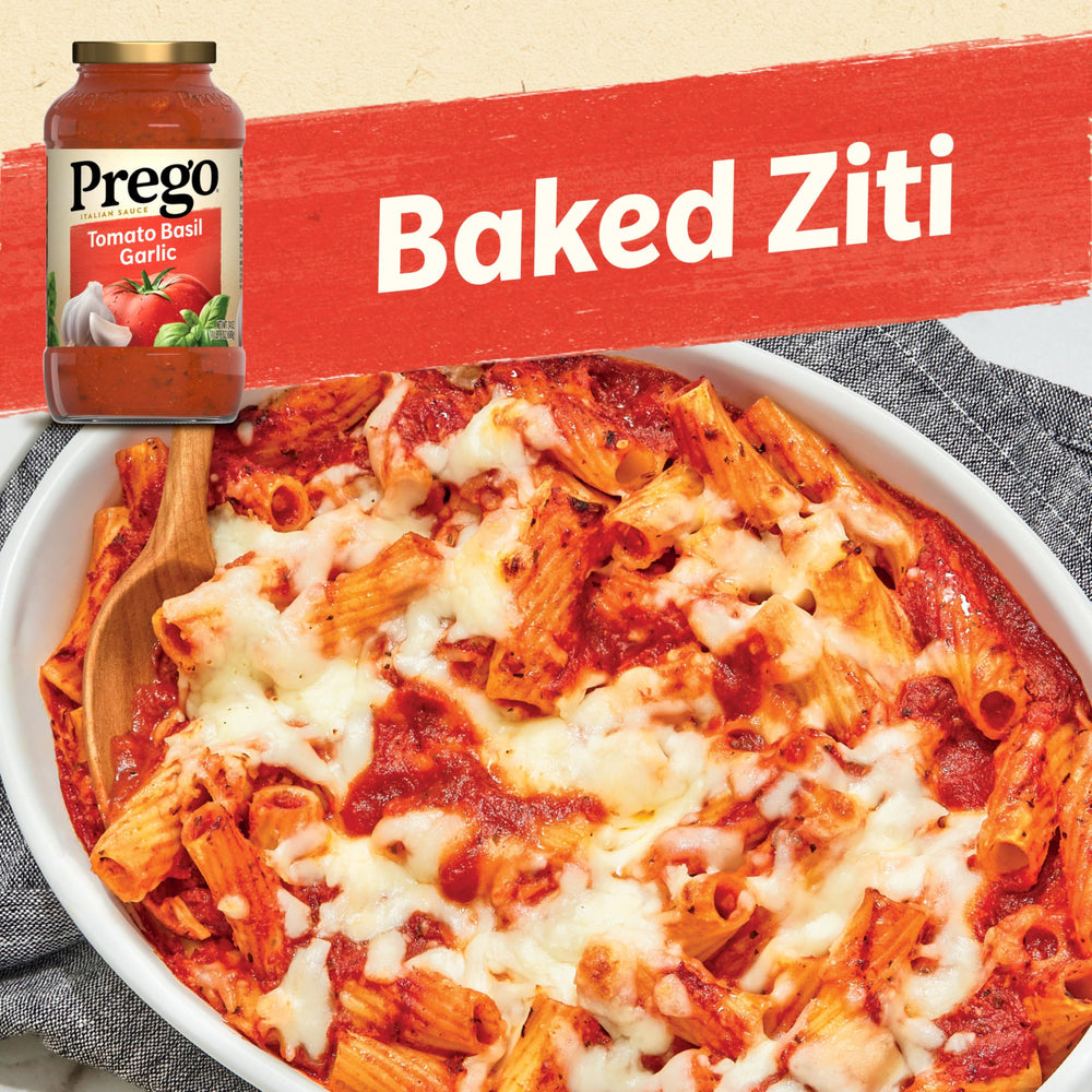 Prego sauce pouring jar showing thick, smooth texture over pasta.