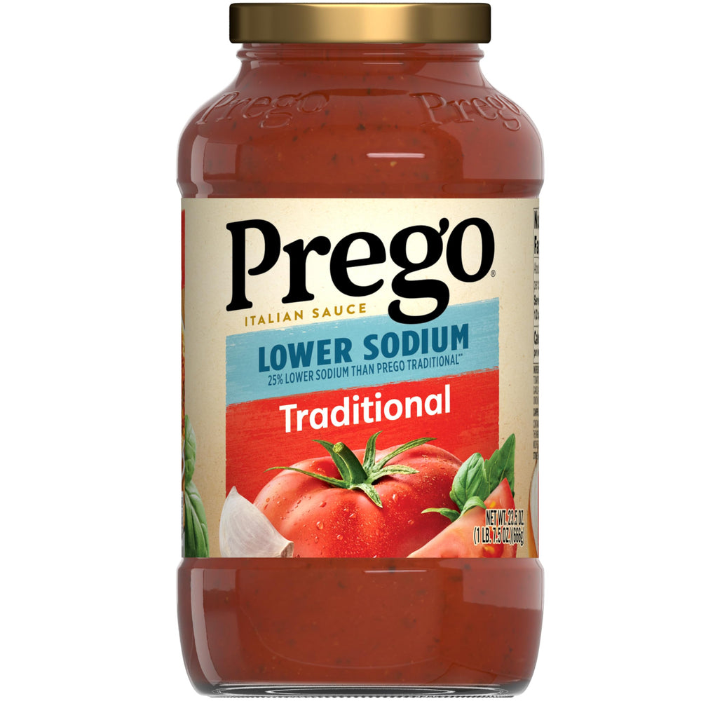 Prego Traditional Lower Sodium pasta sauce jar with thick, smooth texture for family meals.