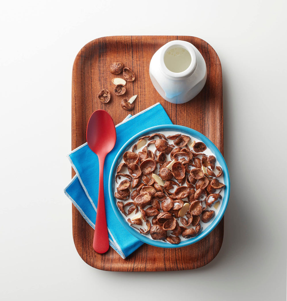 Premier Protein Chocolate Almond Cereal close-up of chocolatey flakes for flavor appeal.