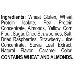 Spoon poised over Premier Protein cereal showing crunchy flakes.