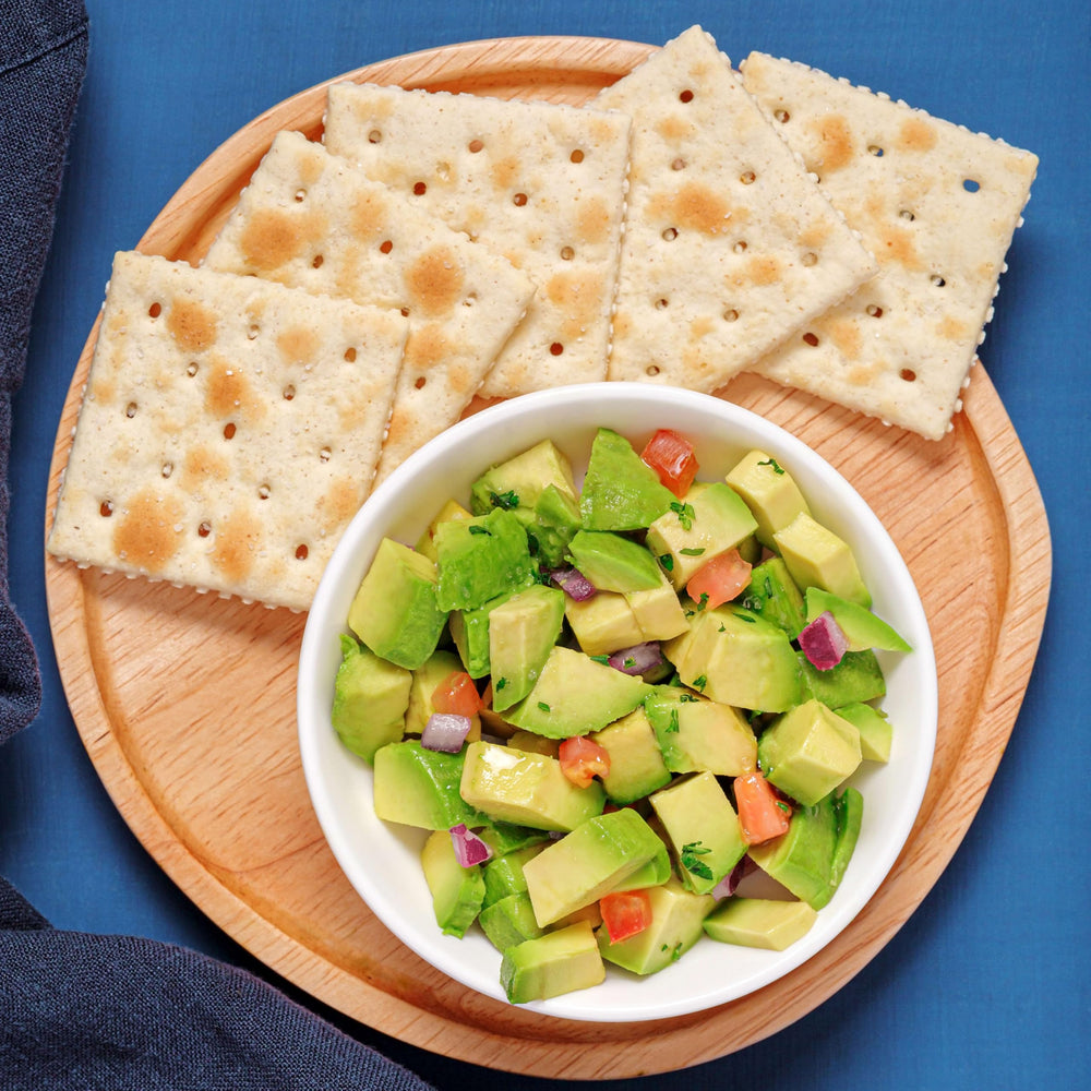 Premium Original Saltine Crackers close-up showing airy crisp texture.