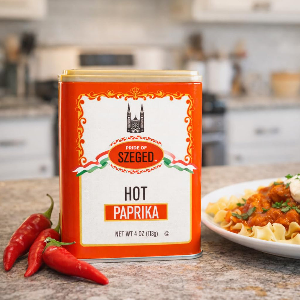 Pride of Szeged hot paprika powder bottle with spices on counter.
