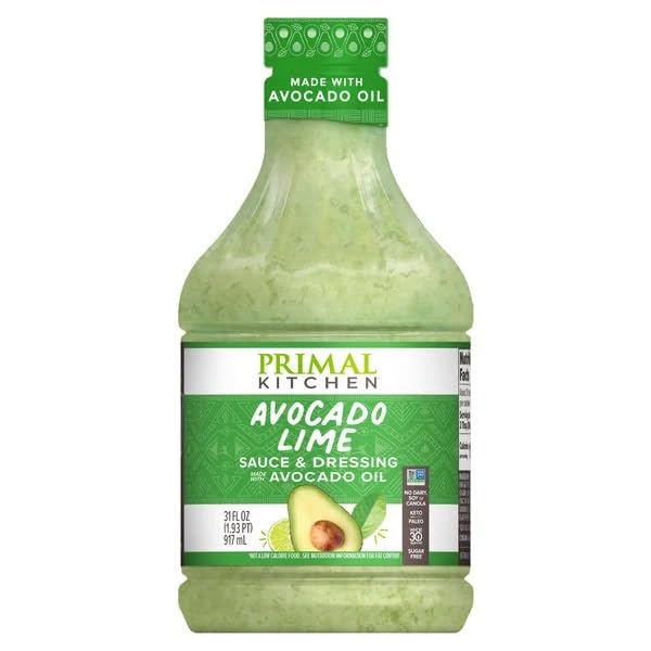 Primal Kitchen Avocado Lime Dressing bottle pour, keto-friendly flavor boost.