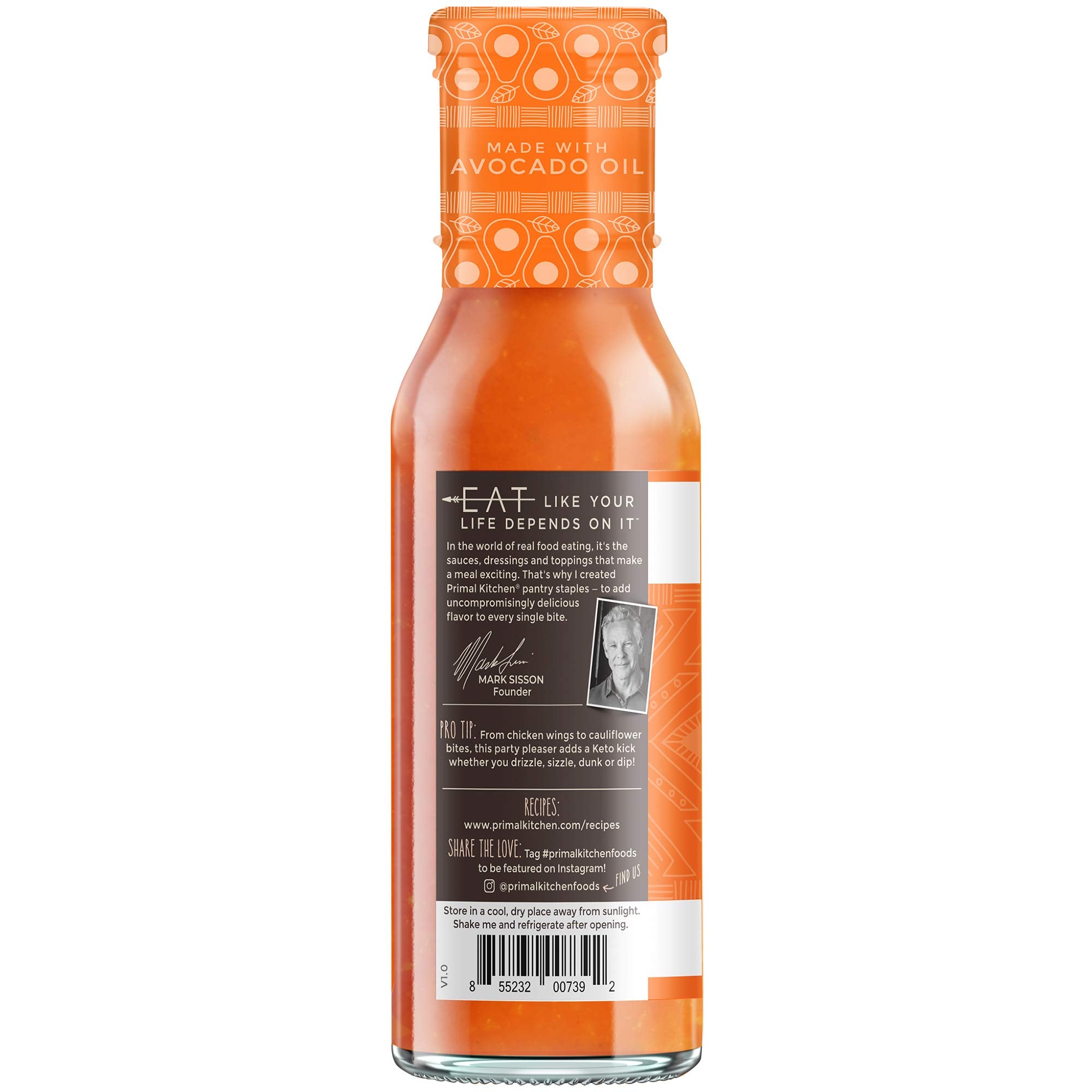 Primal Kitchen Buffalo Sauce bottle pour, versatile heat perfect for dips and drizzles.