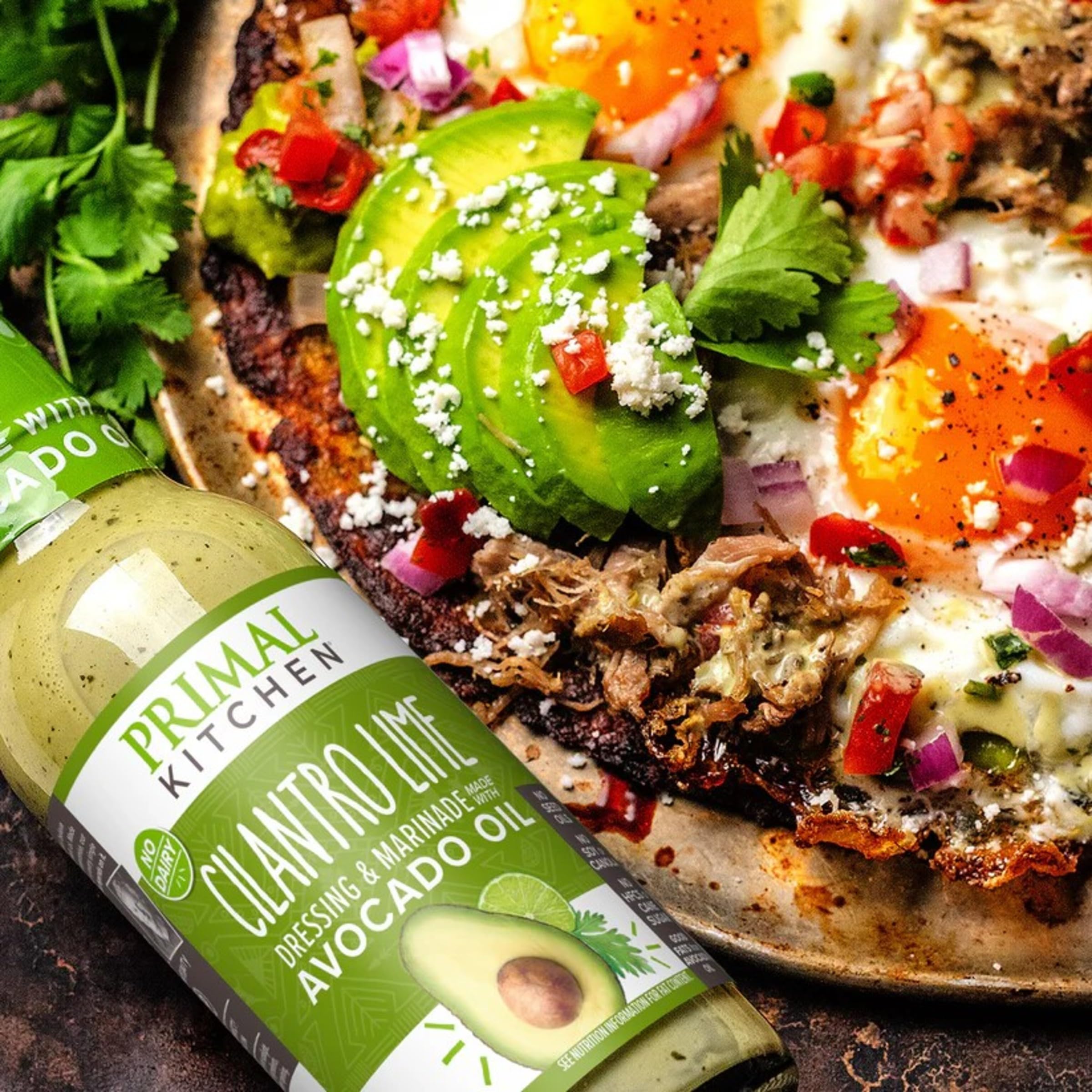 Primal Kitchen Cilantro Lime Dressing drizzled over roasted vegetables.