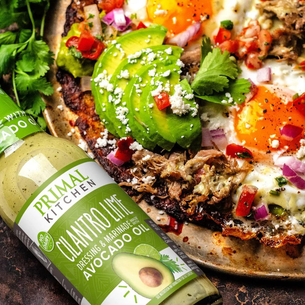 Primal Kitchen Cilantro Lime Dressing drizzled over roasted vegetables.