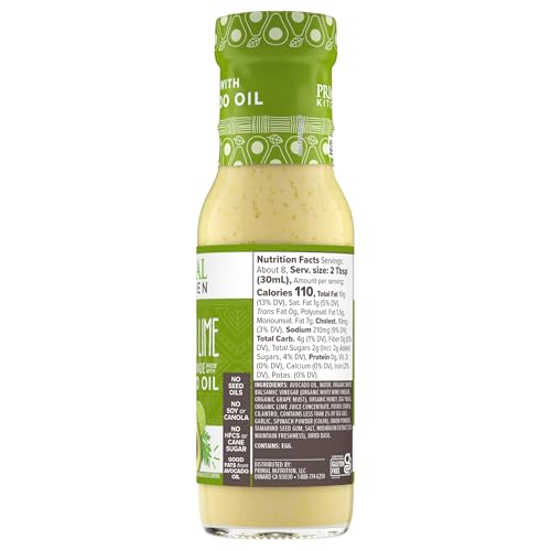 Primal Kitchen Cilantro Lime Dressing beside lime wedges on counter.