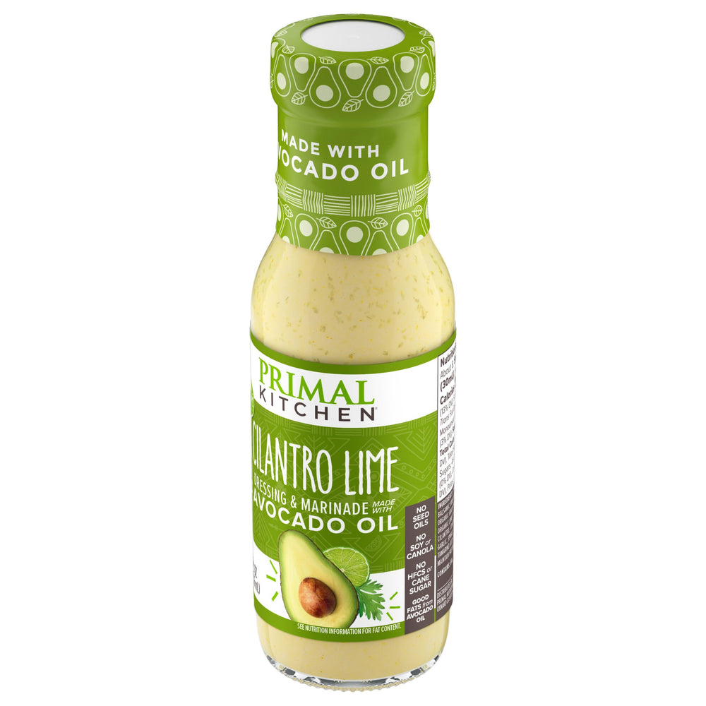 Primal Kitchen Cilantro Lime Dressing with fresh vegetables on a tray.