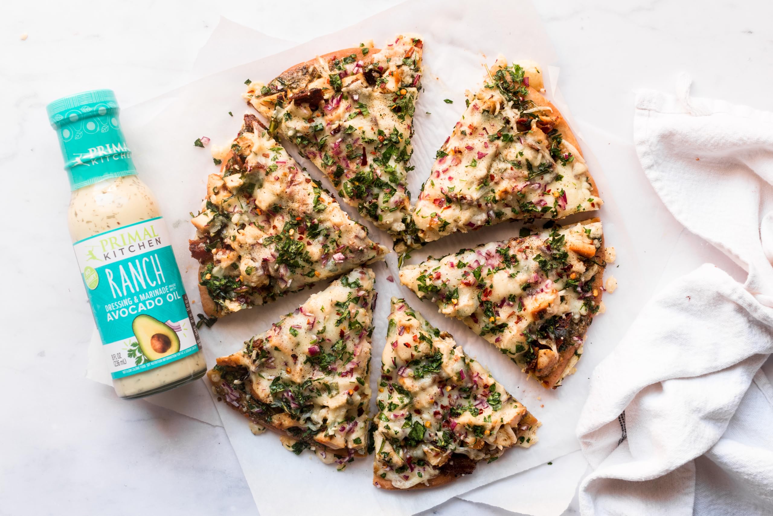 Primal Kitchen creamy dressings with veggie sticks; perfect dip and drizzle.
