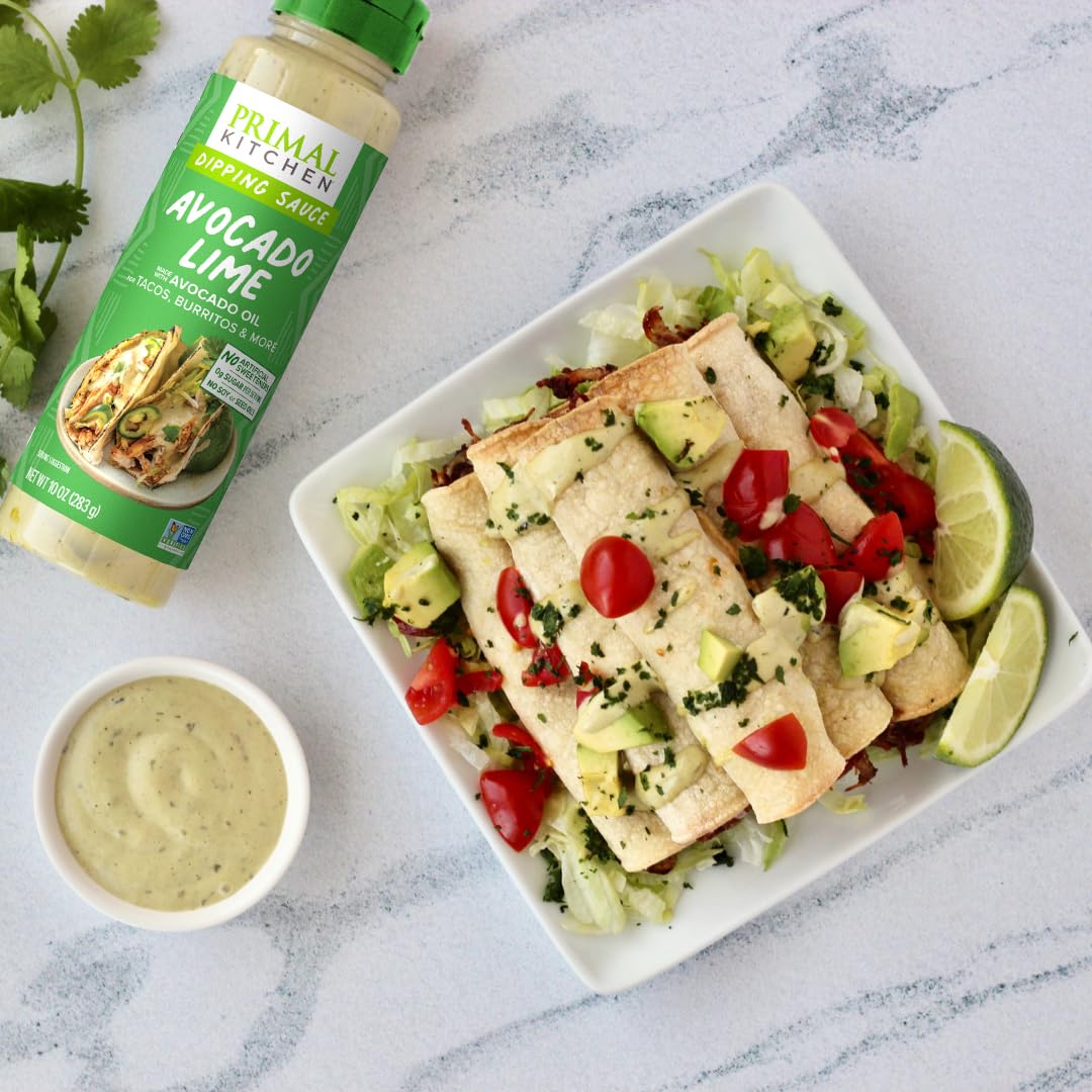 Primal Kitchen Chicken Dippin' sauce bottle shown dunking chicken tenders