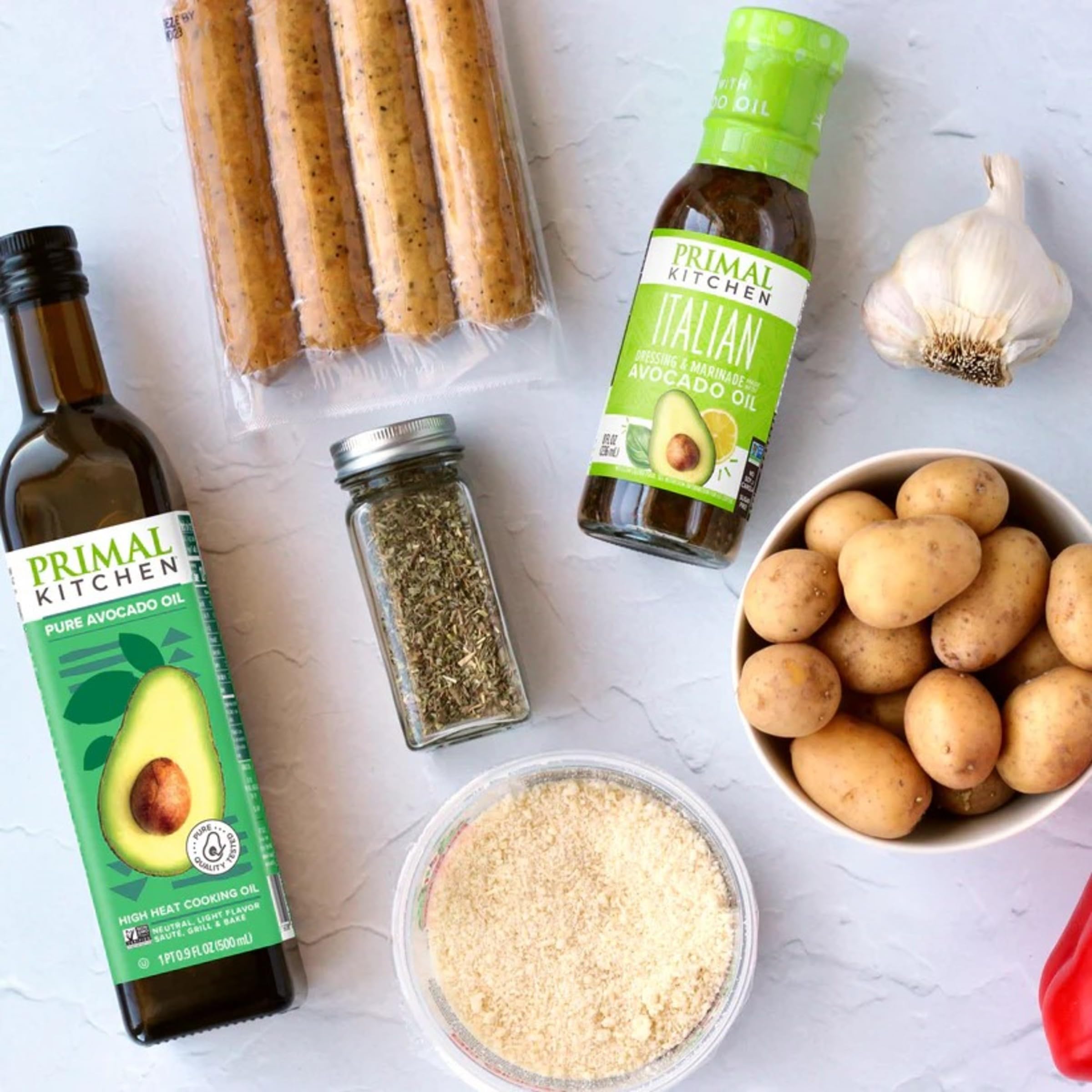 Primal Kitchen Italian Vinaigrette kitchen scene with herbs