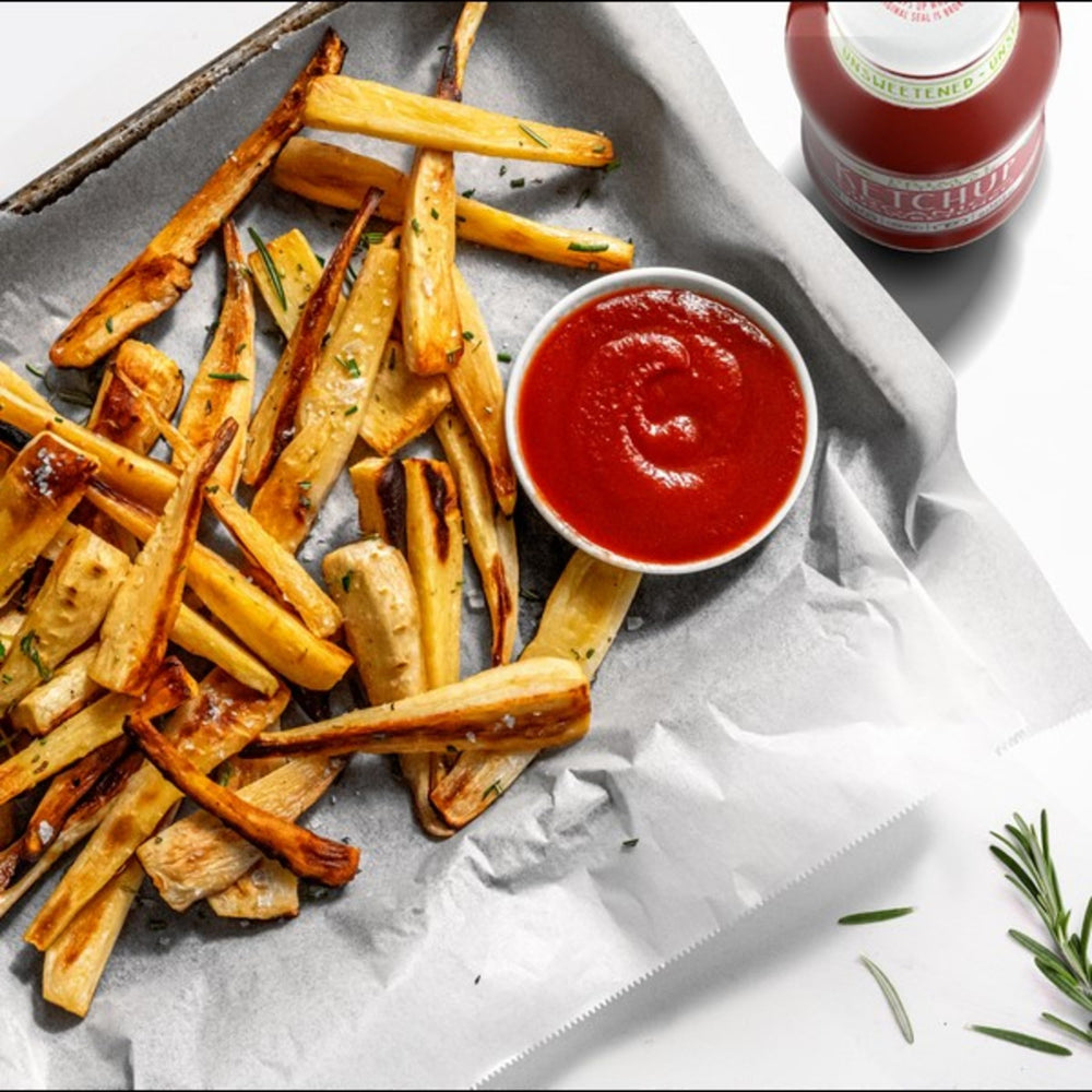 Primal Kitchen Ketchup Unsweetened fries dipping scene highlights versatile dipping sauce.