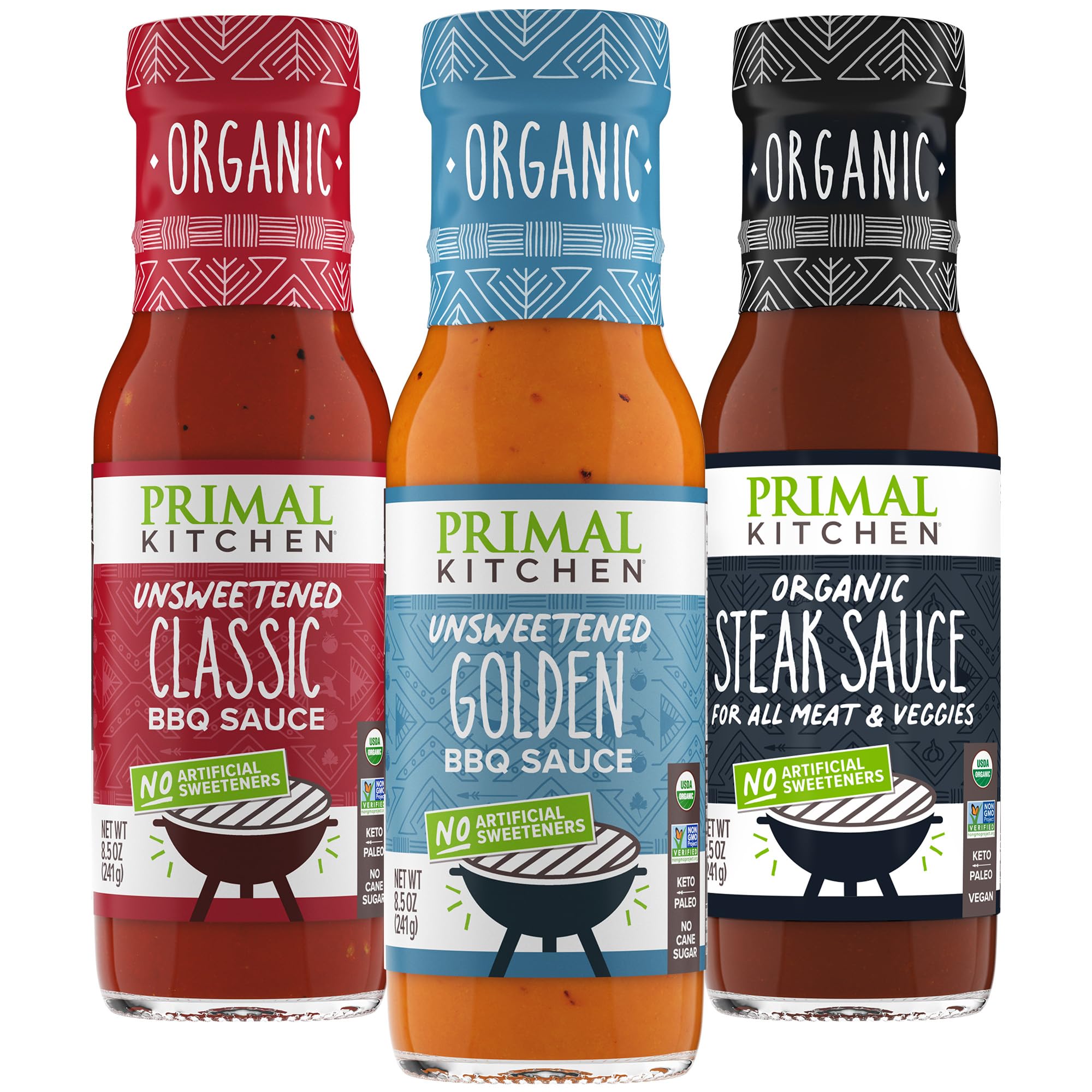 Primal Kitchen Original BBQ sauce bottle pouring onto sizzling vegetables for grilling and marinating