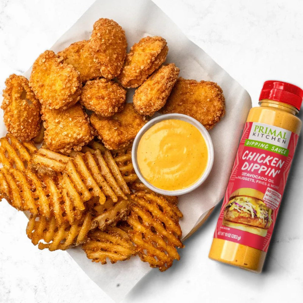 Primal Kitchen Sauce Dip Chicken poured over veggies suggests a tasty, easy meal upgrade.
