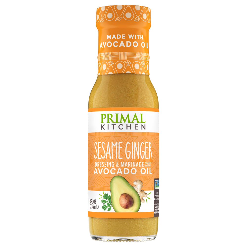Primal Kitchen sesame ginger bottle pour showing versatile dressing option for salads
