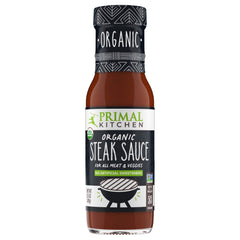 Primal Kitchen Organic Steak Sauce bottle highlighting USDA Organic and sugar-free flavor.