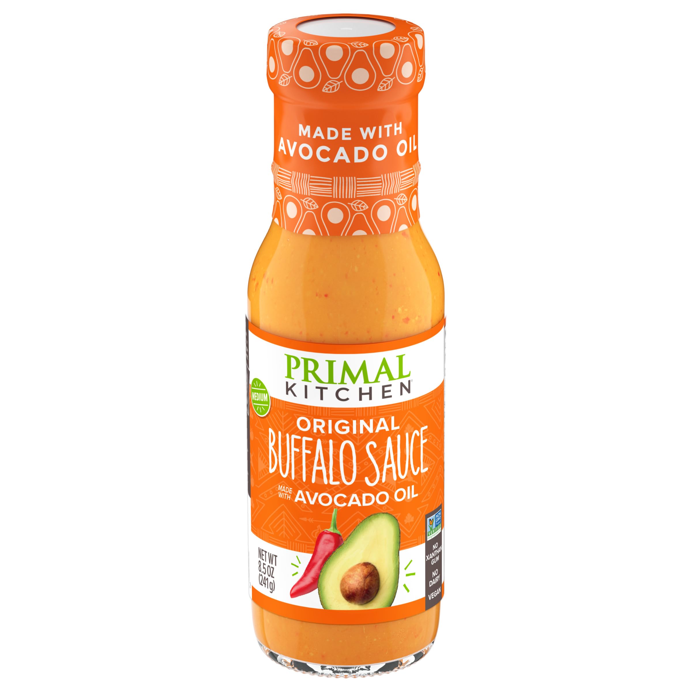 Primal Kitchen No Dairy Buffalo Sauce bottle pour shows creamy, dairy-free heat for wings