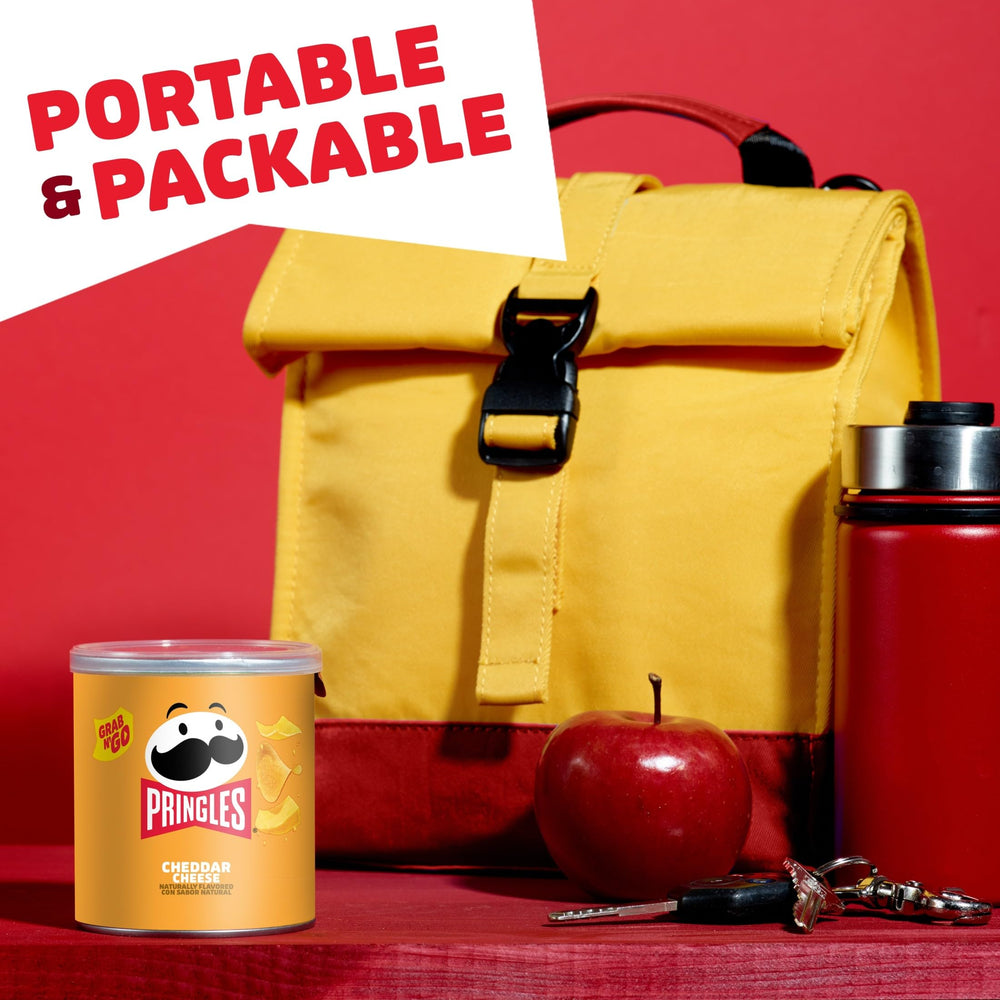 Game-night setup featuring Pringles Cheddar Cheese cans.
