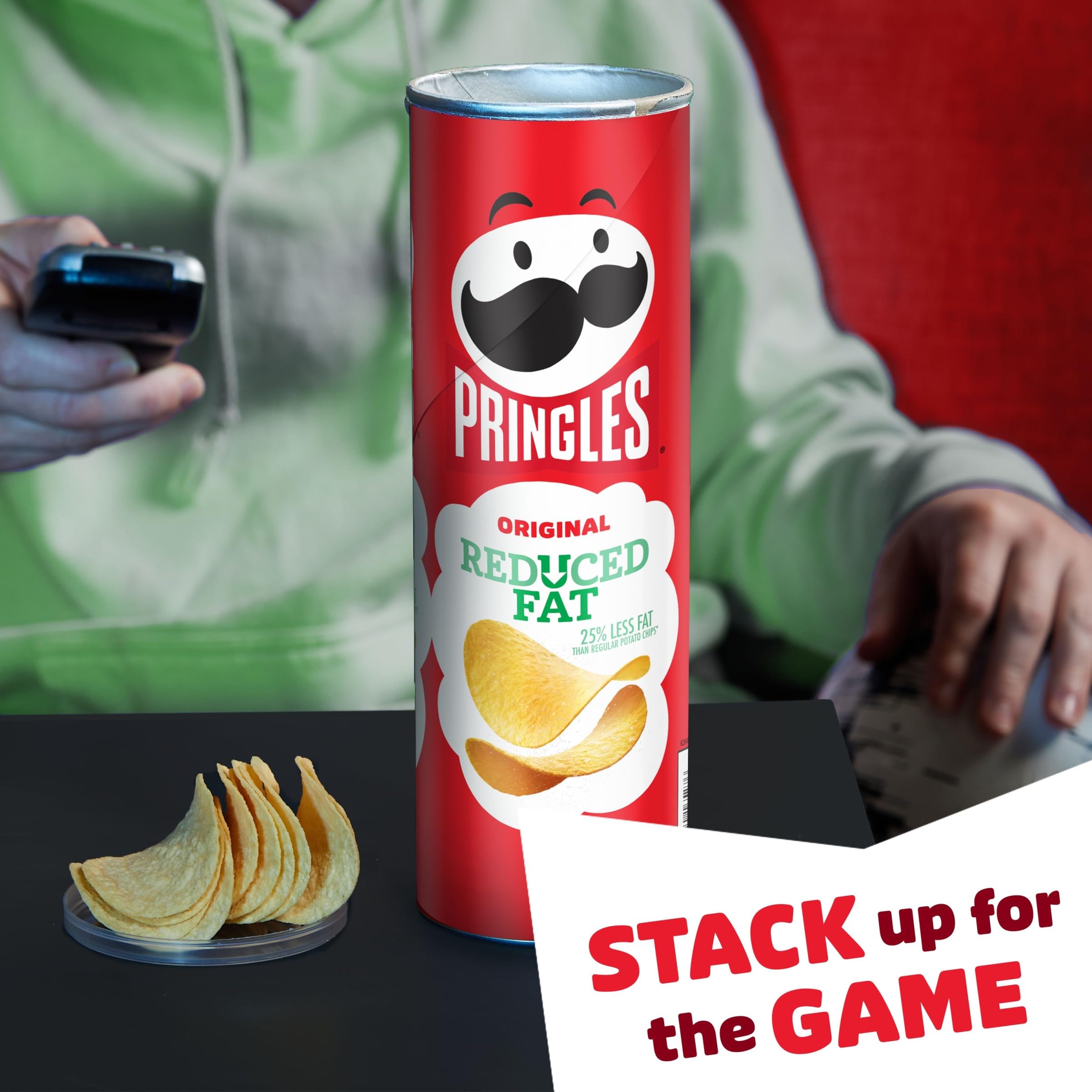 Pringles Reduced Fat can on desk, a quick office snack during breaks.