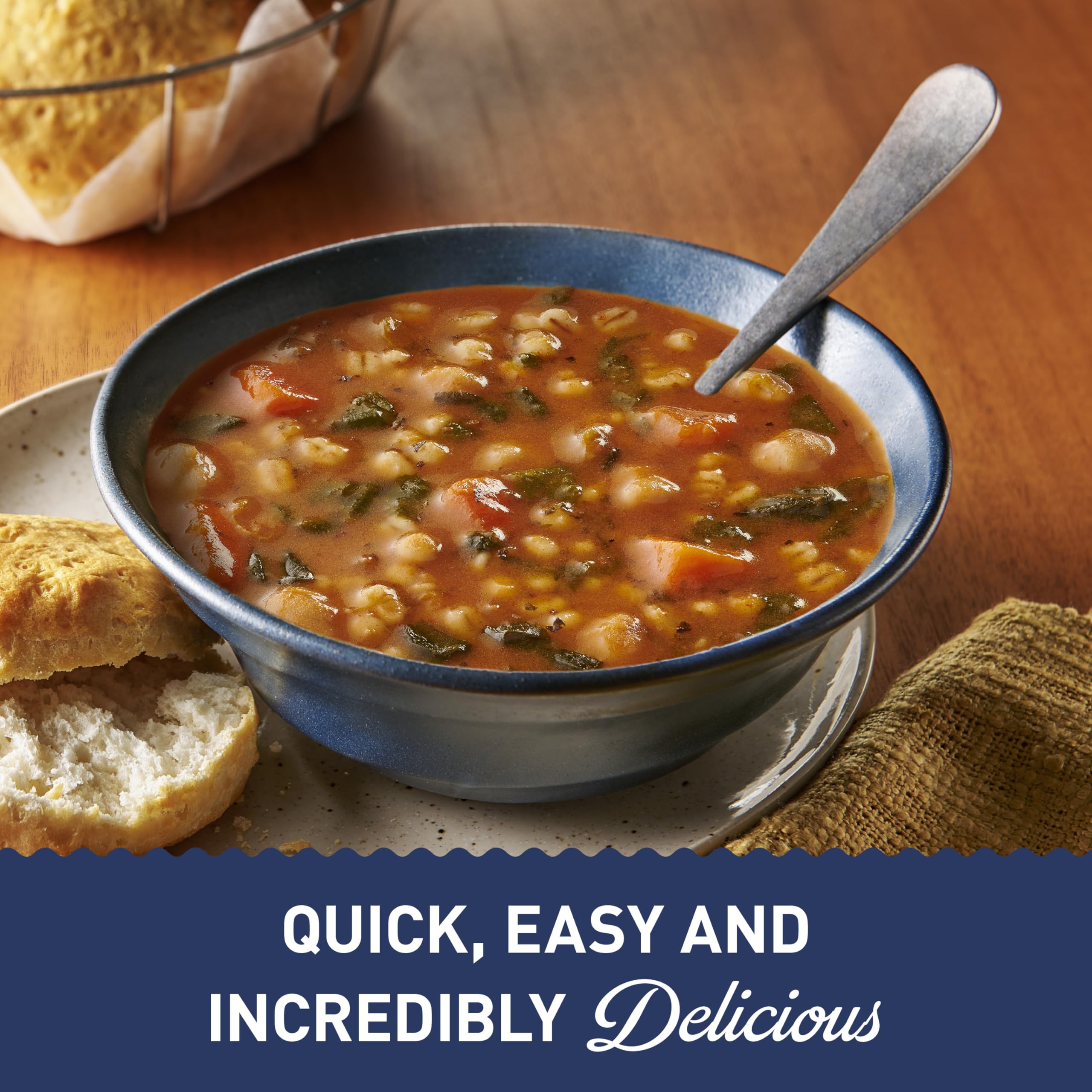 Pouring Progresso Protein Hearty Grain Vegetable Soup into a mug.