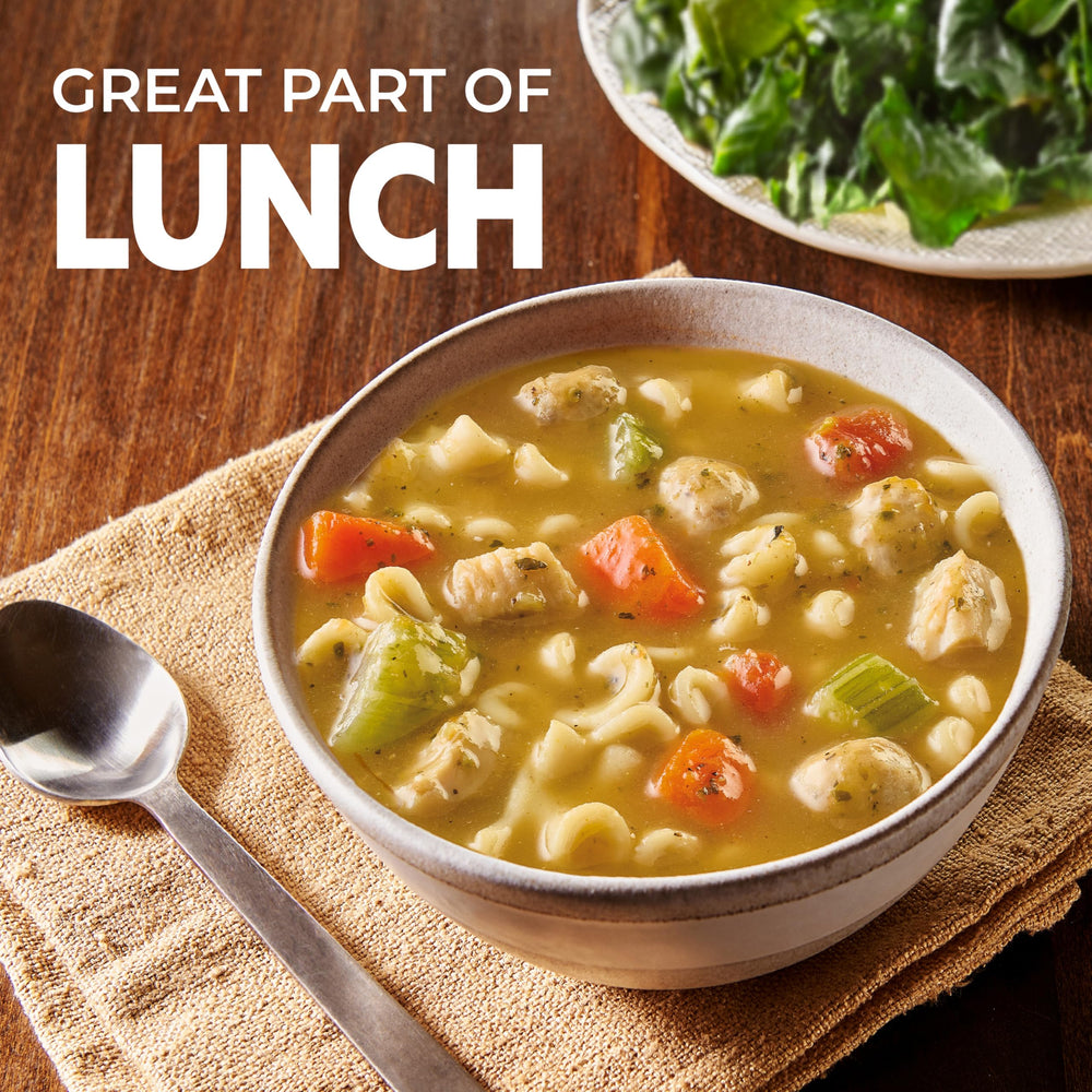 Prepared bowl of Progresso soup with visible chicken chunks and carrots for comforting dinner.