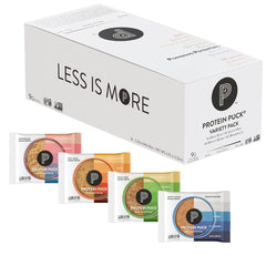 Protein Puck variety pack bars displayed on shelf for on-the-go energy.