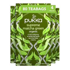 Pukka Supreme Matcha tea bag closeup showcasing vibrant, caffeine-free infusion aroma.