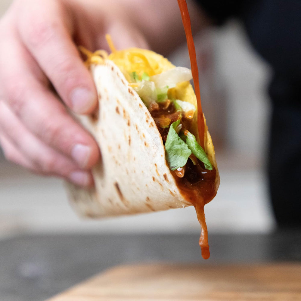 PUP AND THE PEPPER Lava Sauce on tacos for savory heat